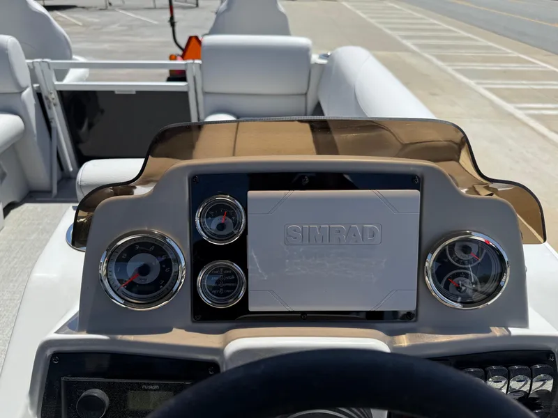 Slide: The Image of Dashboard of a 2022 Avalon Venture Fish boat with Simrad navigation system. - 41