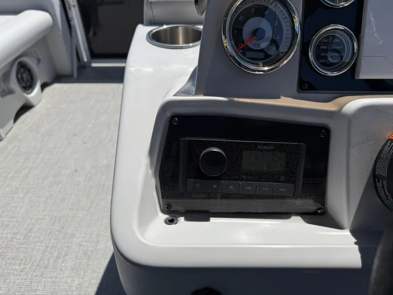 Slide: The Image of Control panel of 2022 Avalon Venture Fish boat with gauges and stereo system. - 43
