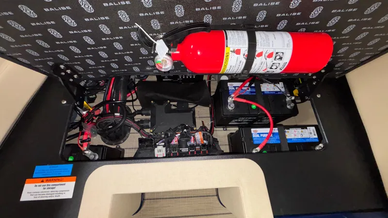 Slide: The Image of Interior view of Balise Helix 26C 2025 showing electrical components and fire extinguisher. - 16