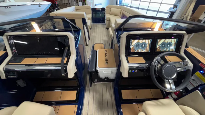 Slide: The Image of 2025 Balise Helix 26C boat interior with dual consoles and modern dashboard displays. - 19