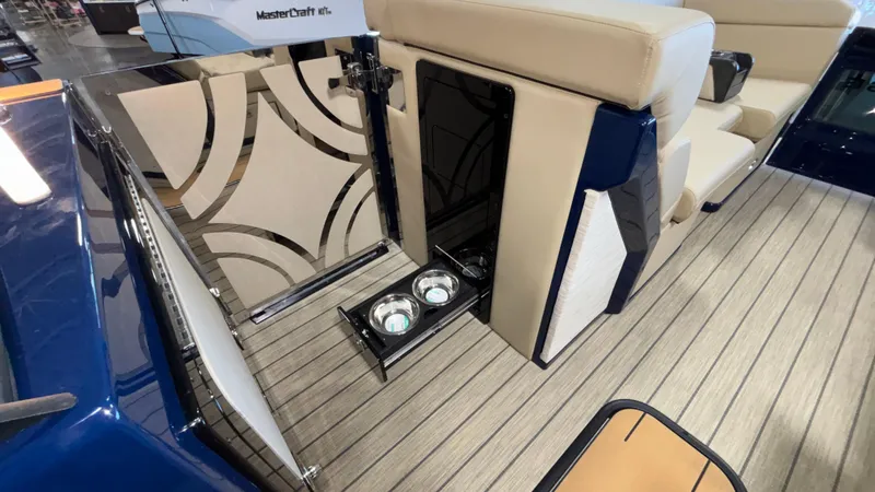 Slide: The Image of 2025 Balise Helix 26C boat interior with modern seating and built-in cup holders. - 26