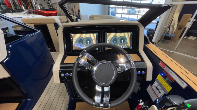 Slide: The Image of 2025 Balise Helix 26C boat dashboard with dual touchscreens and modern steering wheel. - 29