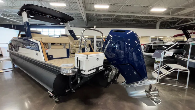 Slide: The Image of 2025 Balise Helix 26C pontoon boat with powerful outboard motor in showroom. - 5