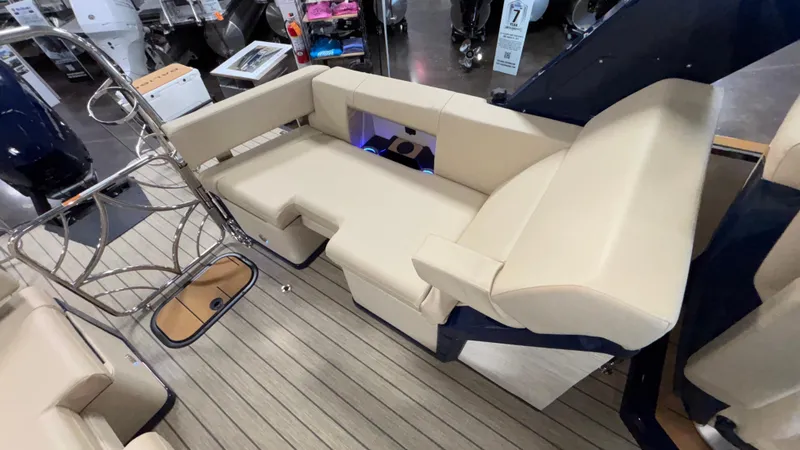 Slide: The Image of Luxurious seating on 2025 Balise Helix 26C boat, featuring beige upholstery and sleek design. - 9