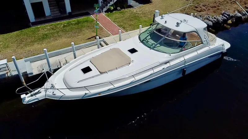 Slide: The Image of 2001 Sea Ray 460 Sundancer yacht docked at a marina, aerial view. - 0