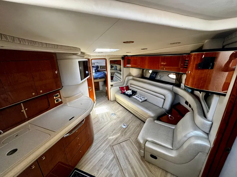 Slide: The Image of Luxurious interior of a 2001 Sea Ray 460 Sundancer yacht with elegant seating and cabinetry. - 10