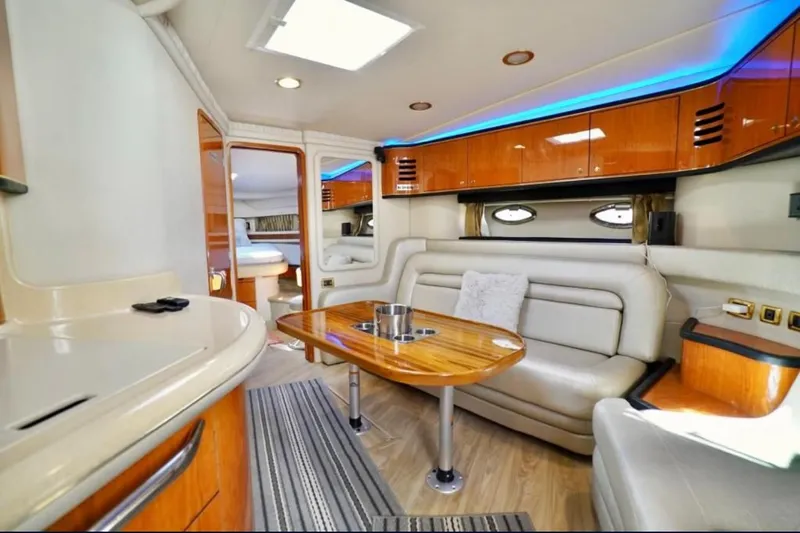 Slide: The Image of Luxurious interior of 2001 Sea Ray 460 Sundancer yacht with elegant seating and modern amenities. - 15