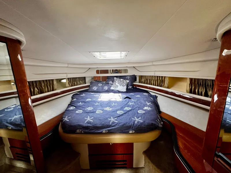 Slide: The Image of Luxurious cabin interior of 2001 Sea Ray 460 Sundancer yacht with cozy bedding. - 21