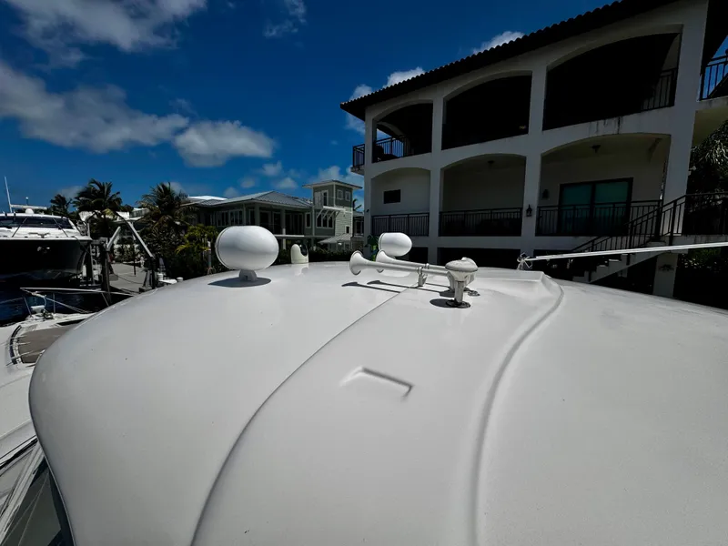 Slide: The Image of Rooftop view of 2001 Sea Ray 460 Sundancer yacht near waterfront homes. - 33