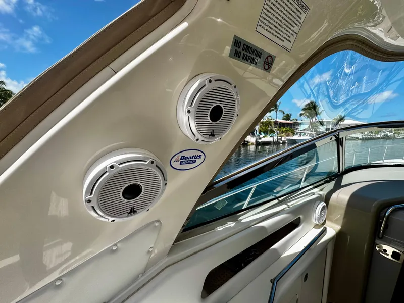 Slide: The Image of 2001 Sea Ray 460 Sundancer boat interior with speakers and waterfront view. - 5