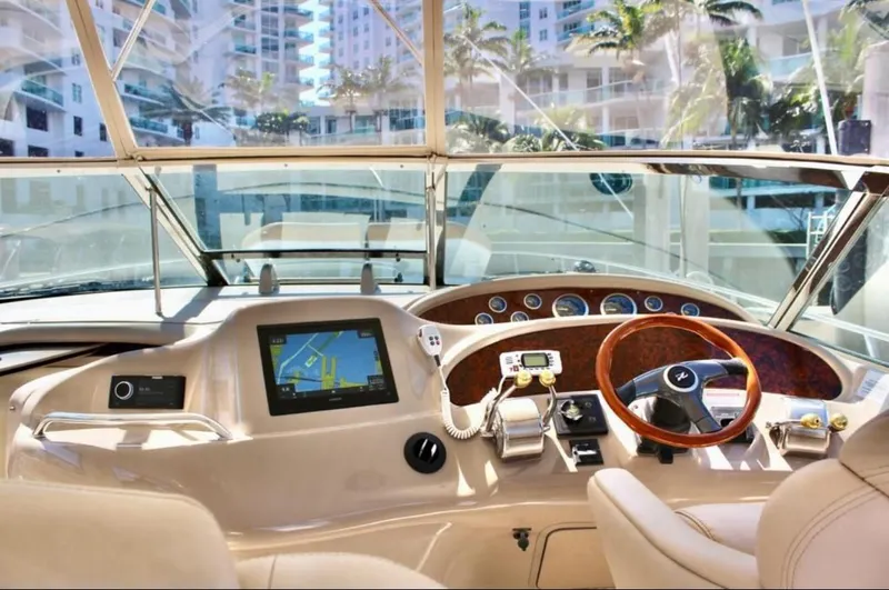 Slide: The Image of Interior view of 2001 Sea Ray 460 Sundancer yacht cockpit with navigation system. - 9