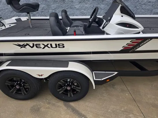 Slide: The Image of 2025 Vexus AVX2080 boat with dual axle trailer, sleek design, and modern seating. - 8