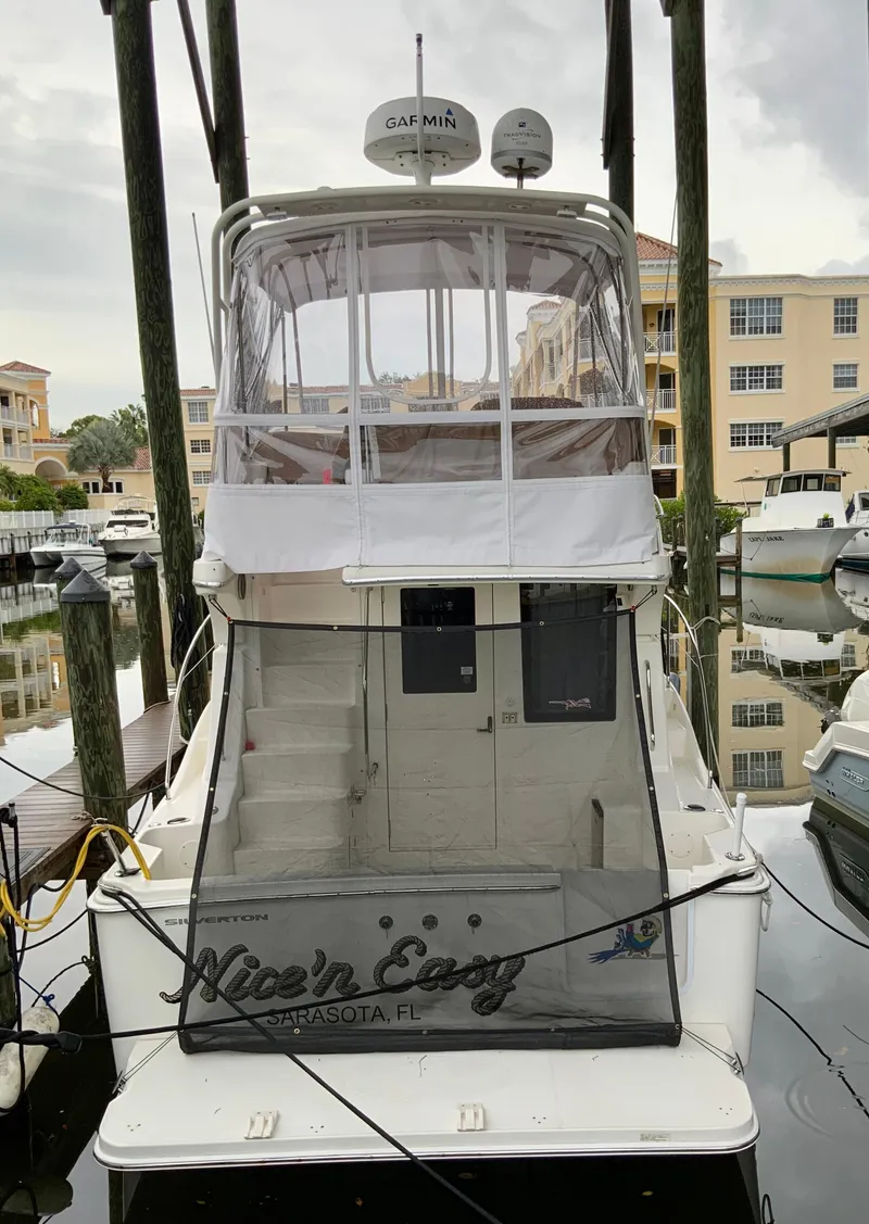 Slide: The Image of 2007 Silverton 33 Convertible boat docked in marina, rear view. - 12