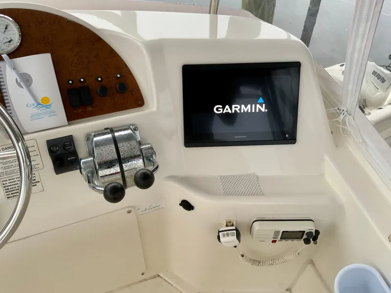 Slide: The Image of 2007 Silverton 33 Convertible helm with Garmin navigation system and controls. - 19