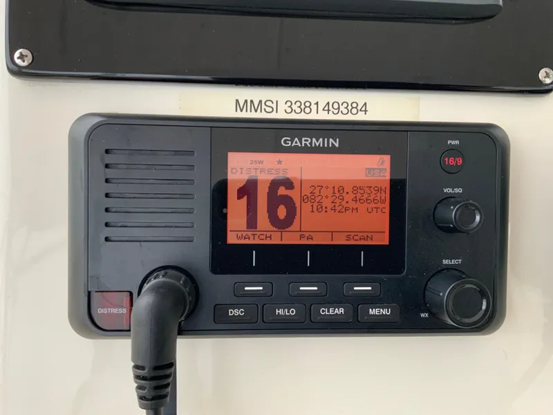 Slide: The Image of Garmin marine radio on 2007 Silverton 33 Convertible, displaying channel 16 and distress signal. - 24