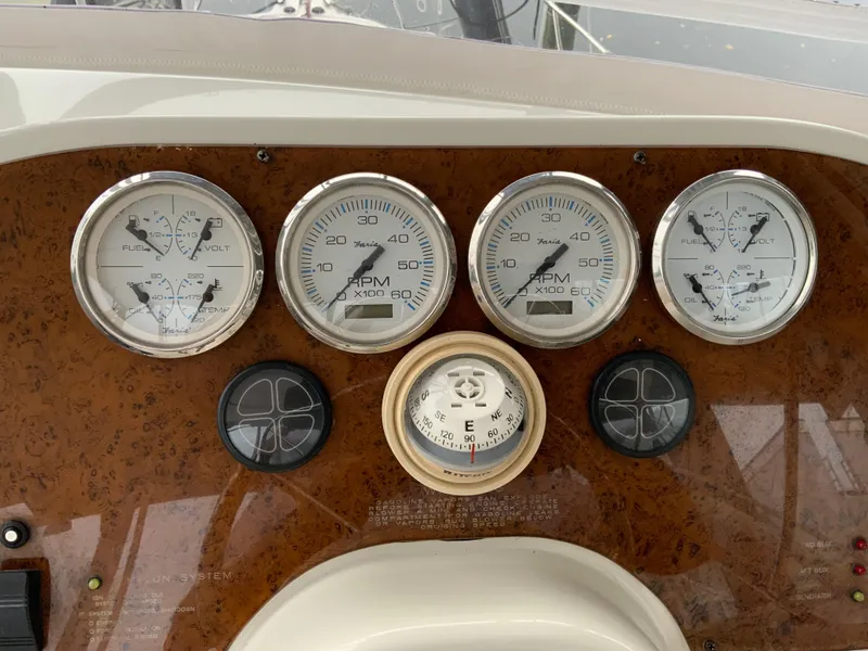 Slide: The Image of Dashboard of a 2007 Silverton 33 Convertible boat with gauges and compass. - 25