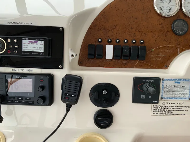 Slide: The Image of Control panel of a 2007 Silverton 33 Convertible boat with navigation and communication equipment. - 26