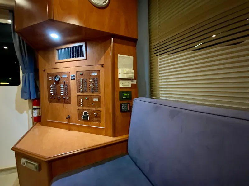 Slide: The Image of Interior of 2007 Silverton 33 Convertible yacht with control panel and seating area. - 38