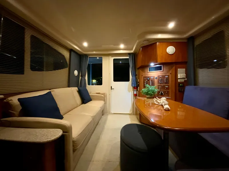 Slide: The Image of Luxurious interior of a 2007 Silverton 33 Convertible yacht with elegant seating and ambient lighting. - 42