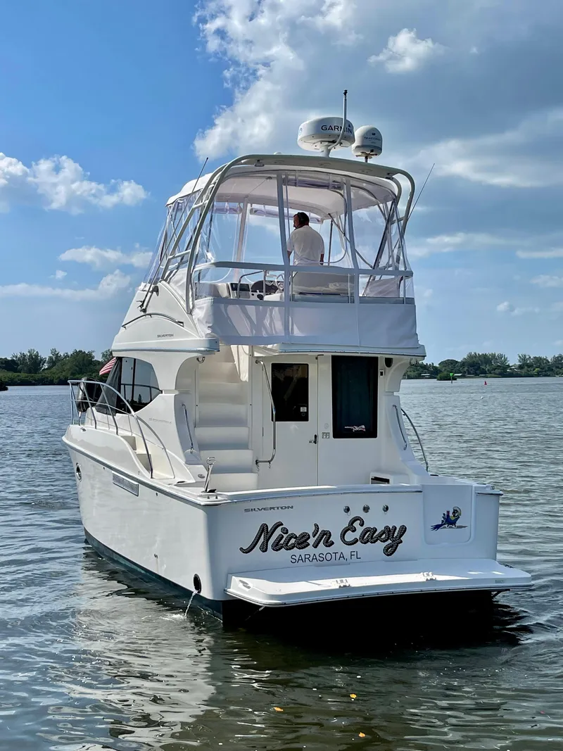 Slide: The Image of 2007 Silverton 33 Convertible yacht on water, clear sky, Sarasota, FL. - 5