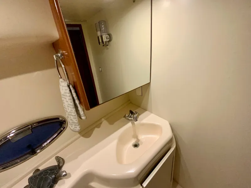 Slide: The Image of 2007 Silverton 33 Convertible bathroom with sink, mirror, and towel. - 51
