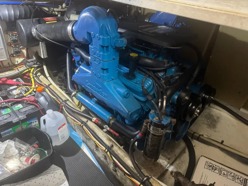 Slide: The Image of Engine compartment of a 2007 Silverton 33 Convertible boat, featuring a blue engine. - 52