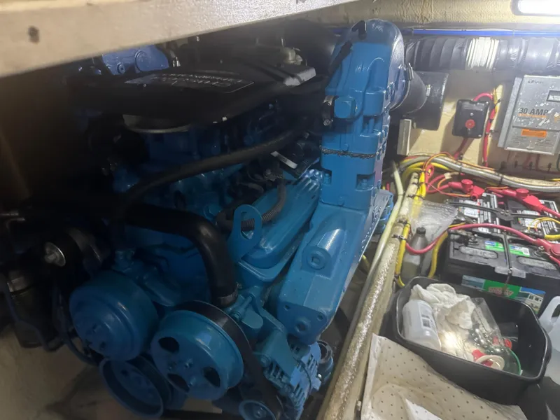 Slide: The Image of Engine compartment of a 2007 Silverton 33 Convertible boat, featuring a blue engine. - 53