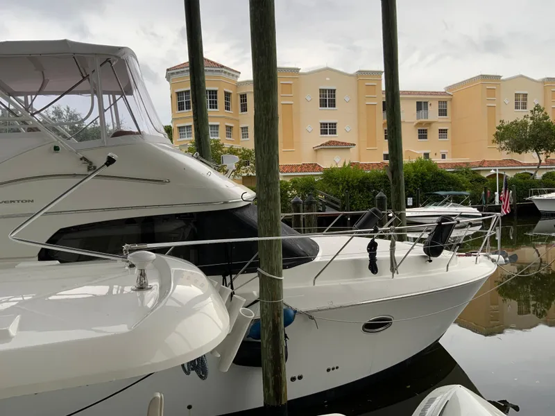 Slide: The Image of 2007 Silverton 33 Convertible yacht docked near waterfront buildings. - 9