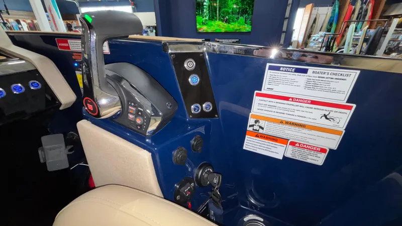 Slide: The Image of Control panel of 2025 Balise Horizon 26C boat with safety instructions and throttle lever. - 17