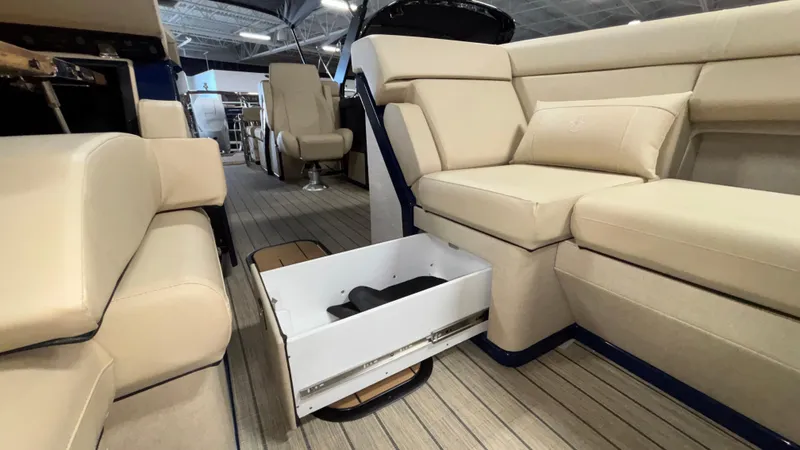 Slide: The Image of Luxurious interior of 2025 Balise Horizon 26C boat with beige seating and storage drawer. - 20