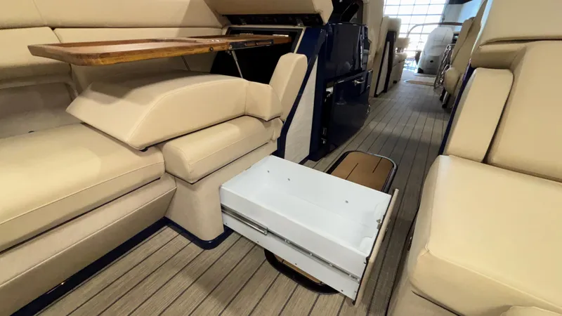Slide: The Image of Luxurious interior of 2025 Balise Horizon 26C boat with beige seating and wooden flooring. - 21