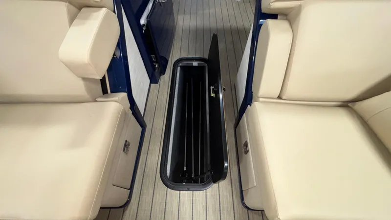 Slide: The Image of Interior of 2025 Balise Horizon 26C boat with open floor storage compartment. - 22