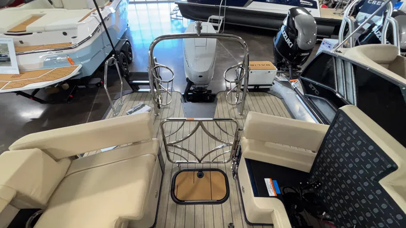 Slide: The Image of 2025 Balise Horizon 26C boat interior with beige seating and metal railings. - 28
