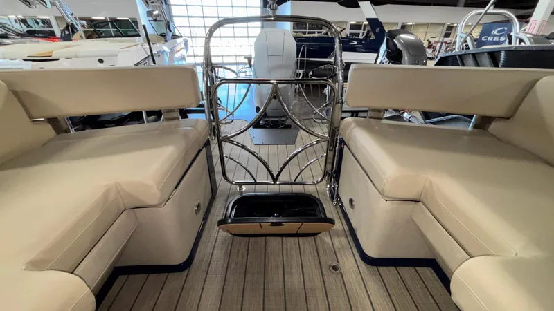 Slide: The Image of 2025 Balise Horizon 26C boat interior with beige seating and metal railing. - 29