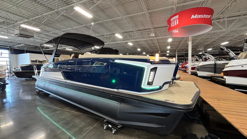 Slide: The Image of 2025 Balise Horizon 26C boat displayed in a showroom, side view. - 3