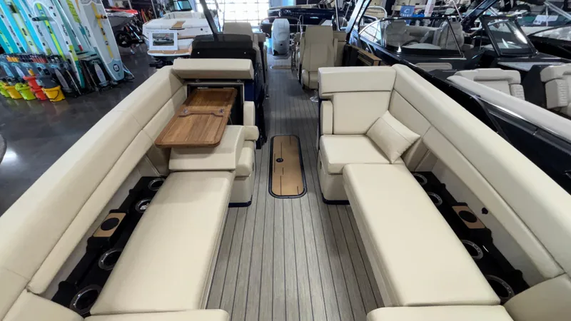 Slide: The Image of 2025 Balise Horizon 26C boat interior with beige seating and wooden accents. - 5