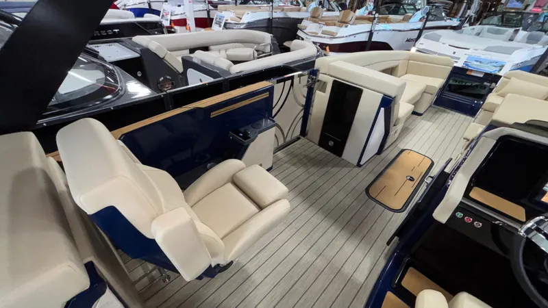 Slide: The Image of 2025 Balise Horizon 26C boat interior with beige seating and sleek design. - 8