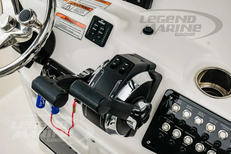 Slide: The Image of Control panel of 2022 NauticStar 2602 Legacy boat with steering wheel and throttle. - 14