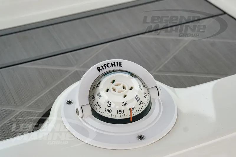 Slide: The Image of Compass on 2022 NauticStar 2602 Legacy boat, featuring Ritchie brand, on deck. - 16