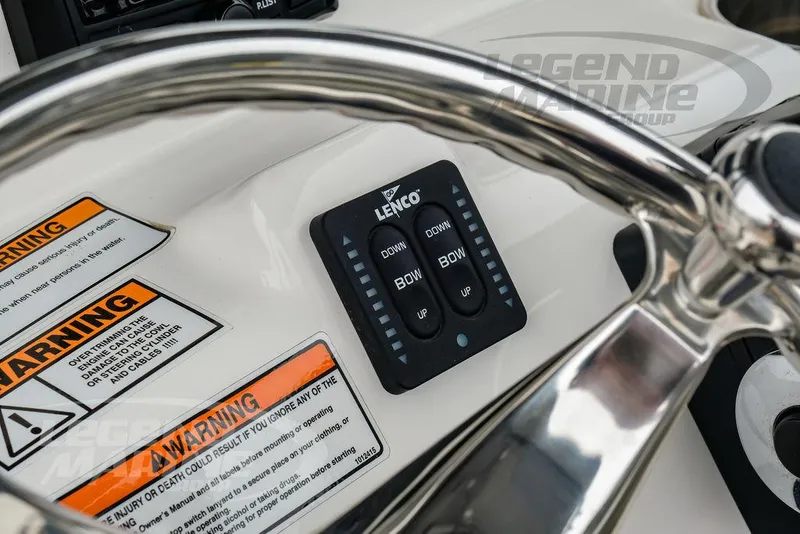 Slide: The Image of Control panel of 2022 NauticStar 2602 Legacy boat with Lenco trim tab switches. - 19