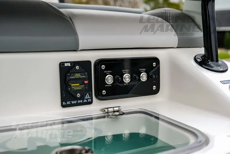 Slide: The Image of Control panel on 2022 NauticStar 2602 Legacy boat featuring Lewmar circuit breaker. - 23