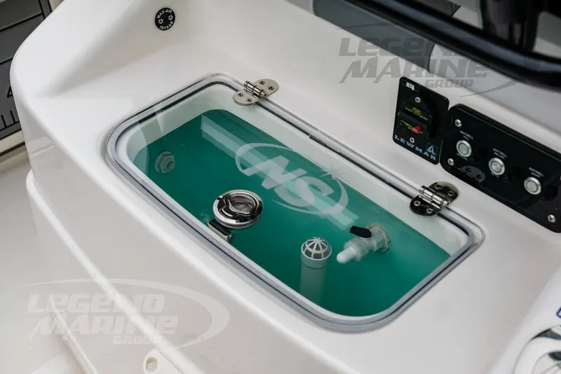 Slide: The Image of Livewell on 2022 NauticStar 2602 Legacy boat, featuring control panel and water intake. - 24