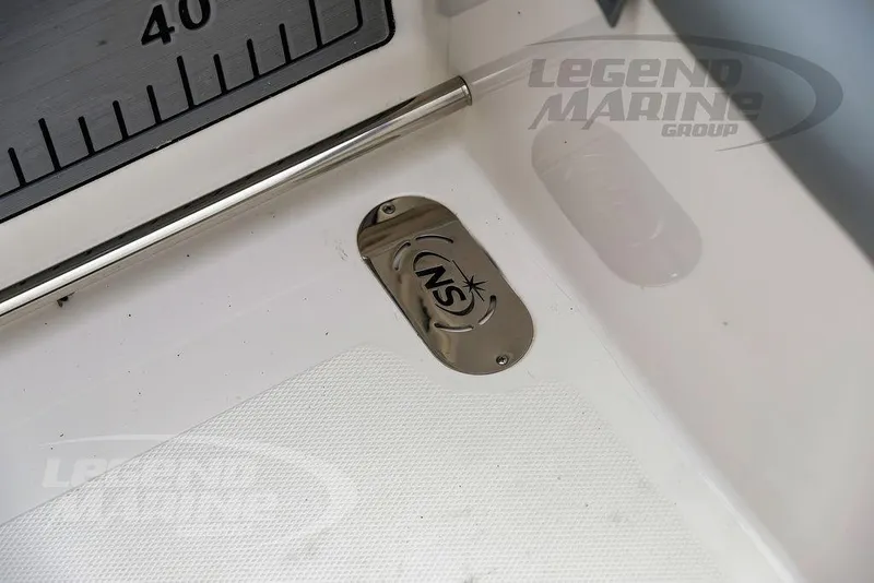 Slide: The Image of 2022 NauticStar 2602 Legacy boat detail with measurement scale and logo. - 28