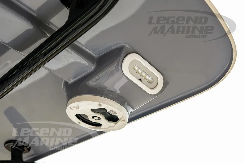 Slide: The Image of 2022 NauticStar 2602 Legacy boat detail with LED light and Legend Marine Group branding. - 34
