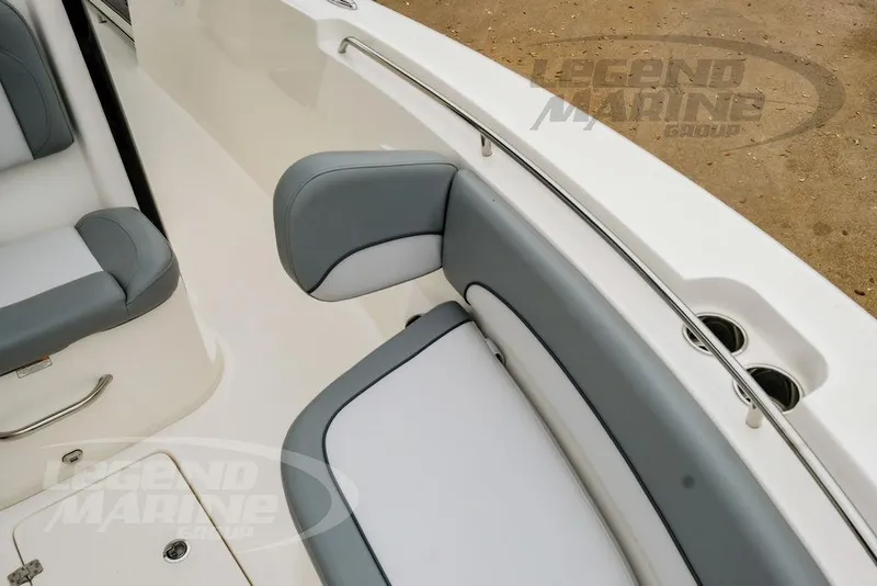 Slide: The Image of 2022 NauticStar 2602 Legacy boat interior with gray and white seating. - 36