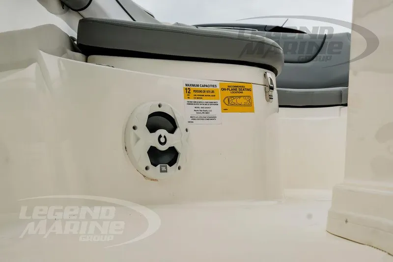 Slide: The Image of 2022 NauticStar 2602 Legacy boat interior with seating and speaker detail. - 38