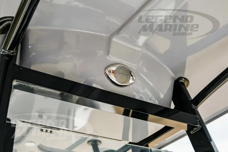Slide: The Image of 2022 NauticStar 2602 Legacy boat interior detail with speaker and Legend Marine Group logo. - 44