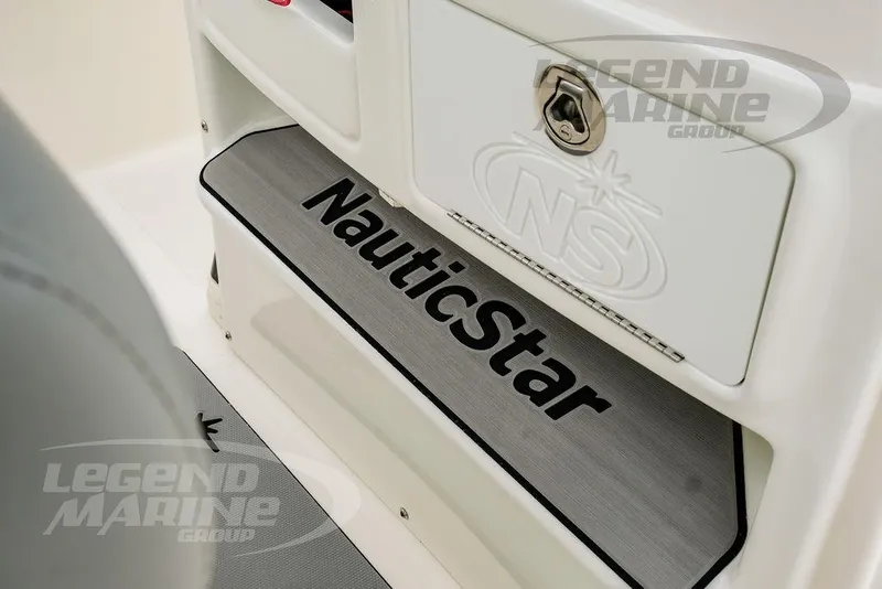 Slide: The Image of 2022 NauticStar 2602 Legacy boat interior with branded step and storage compartment. - 45
