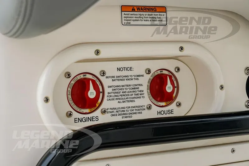 Slide: The Image of Battery control panel on 2022 NauticStar 2602 Legacy boat with warning and instructions. - 48