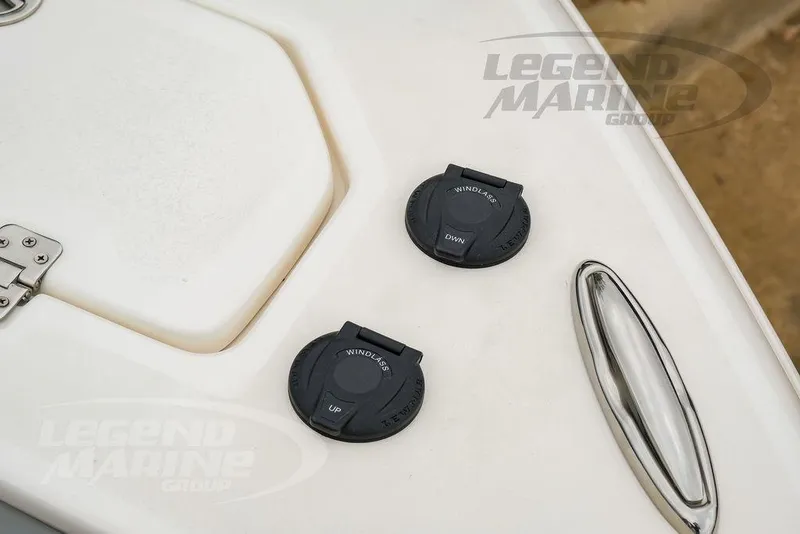 Slide: The Image of 2022 NauticStar 2602 Legacy boat deck with windlass controls and cleat. - 49